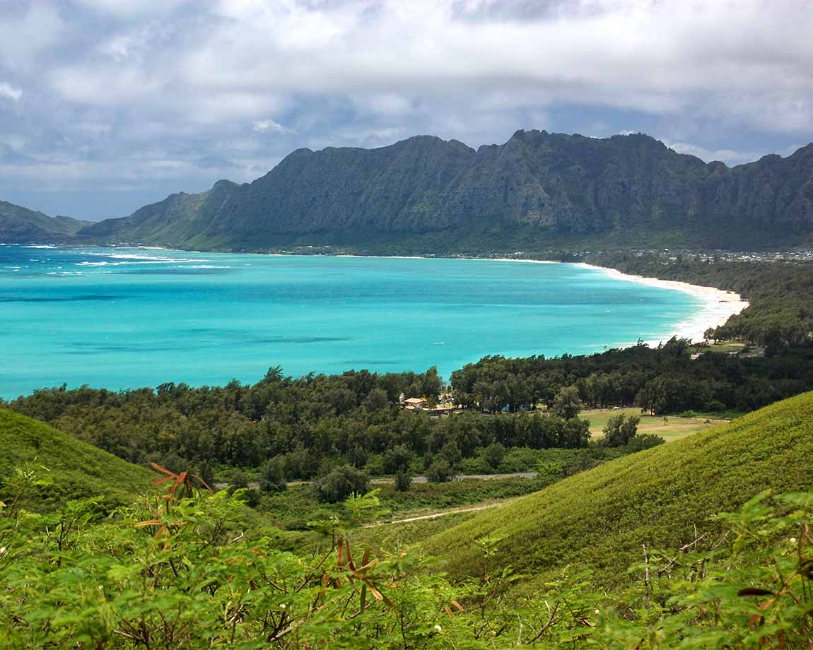 The azure blue ocean of Waimanalo Bay lined by whitesand beach The